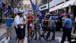 Supporters of Republican presidential nominee Donald Trump gather near the hotel in Philadelphia where Democratic nominee, Vice President Kamala Harris, was set to arrive, Sept. 9, 2024, ahead of the presidential debate.