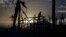 A man is silhouetted as he builds a wooden house in an area destroyed by Typhoon Haiyan, in Palo November 19, 2013. 