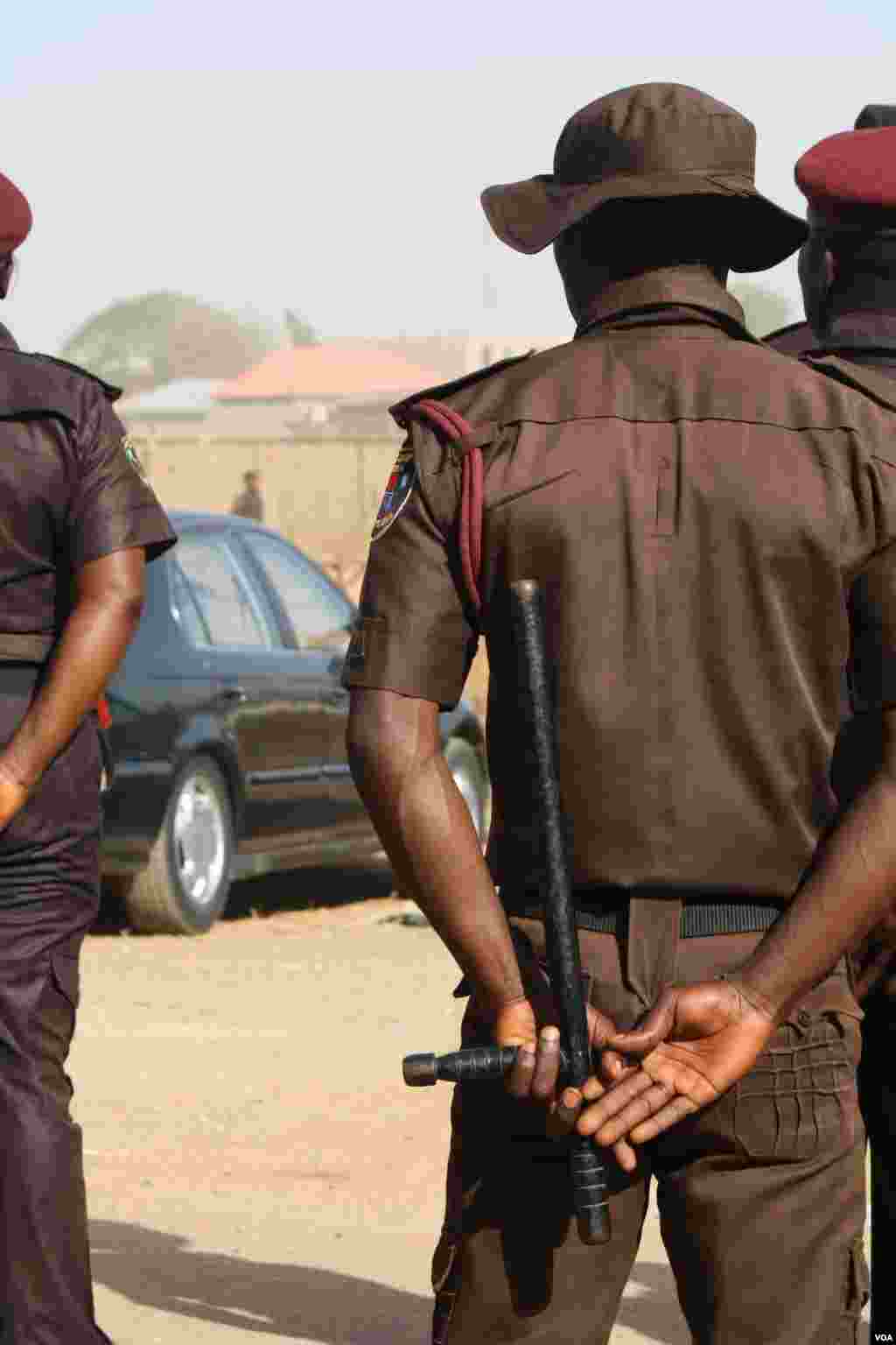 Civilian security groups technically don’t carry arms, but they can often be seen with clubs, sticks poked with nails or other weapons, Kaduna, Nigeria, Feb. 14, 2014. (Heather Murdock/VOA)