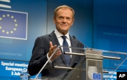 FILE - Then-European Council President Donald Tusk speaks during a media conference at an EU summit in Brussels, July 2, 2019.