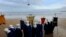 People role playing as members of the royal entourage await the arrival of the Three Wise Men by helicopter, at San Lorenzo beach in Gijon.&nbsp;Children in Spain traditionally receive their Christmas presents on the morning of Jan. 6, delivered by the Three Wise Men.