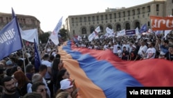 Supporters of a bloc led by the country's former president, Robert Kocharyan, attend a campaign rally ahead of the upcoming snap parliamentary election in Yerevan, Armenia, June 18, 2021. 