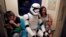 A fan dressed as a Storm Trooper from "Star Wars" reacts at the Taipei Metro (MRT) during Star Wars Day in Taipei, Taiwan, May 4, 2017. 