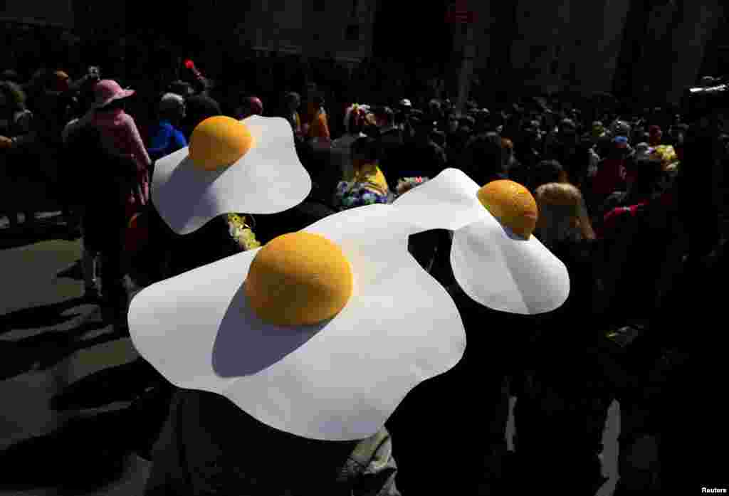 People take part in the Easter Parade and Bonnet Festival along 5th Avenue in New York City, April 5, 2015.