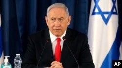 Israeli Prime Minister Benjamin Netanyahu chairs the weekly cabinet meeting in Jerusalem, Sunday, June 7, 2020. (Menahem Kahana/Pool Photo via AP)