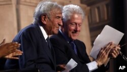 Former President Bill Clinton and Nobel Peace Prize laureate Elie Wiesel participate in an event for the 20th anniversary of the United States Holocaust Memorial Museum in Washington, April 29, 2013. 