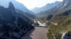 This aerial view shows waste stuck at the dam on the Neretva river caused by landslides, torrential rain and flash floods in Grabovica, Bosnia, Oct. 13, 2024.