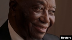 FILE — Liberia's President Joseph Boakai smiles during an interview with Reuters at his home in Monrovia, on November 19, 2023. 