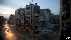 Syrian government airstrikes continue to destroy Aleppo suburbs, June 30, 2012, while officials in Damascus estimate damage to more than 9,000 government structures in the past two years. 