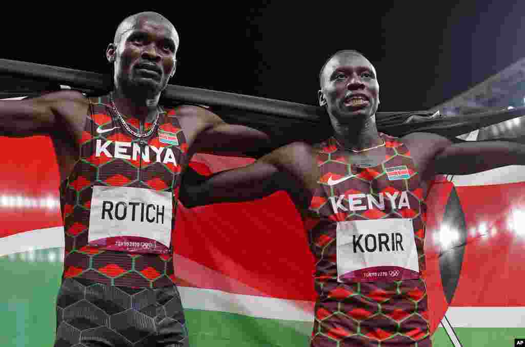 Emmanuel Korir, of Kenya, celebrates winning the gold medal ahead with Ferguson Rotich, of Kenya, silver, after the final of the men's 800-meter at the 2020 Summer Olympics, Wednesday, Aug. 4, 2021, in Tokyo, Japan. (AP Photo/Francisco Seco)