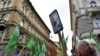 FILE - People march during a protest against the government's alleged use of powerful spyware to spy on opponents, in Budapest, Hungary, July 26, 2021.