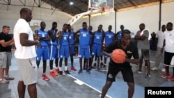 Olumide Oyedeji, a former NBA player, works with young players at the skills development station of the National Basketball Association's first training academy in Thies, east of Dakar, Senegal, May 2, 2017.