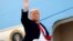 Donald Trump salutes as he boards Air Force One at after visiting the U.S.-Mexico border wall