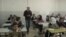 In a classroom of Palestinian 10th graders in the town of Taybeh, Ismat Mansour encourages his students to discuss the advantages of learning Hebrew.