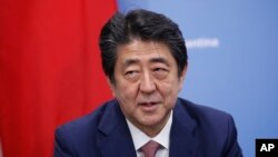 FILE - Japan Prime Minister Shinzo Abe, talks during a meeting with President Donald Trump, Nov. 30, 2018 in Buenos Aires, Argentina.