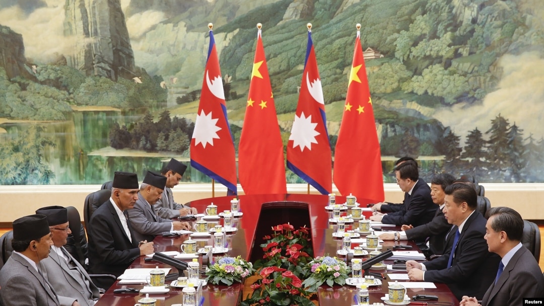 Chinese President Xi Jinping (2nd-R) meets Nepal Prime Minister Khadga Prasad Sharma Oli (2nd L) at the Great Hall of the People in Beijing, China March 21, 2016.