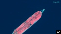 File - This satellite image provided by Maxar Technologies shows the tanker moored off of Yemen on June 17, 2020. The U.N. is seeking $144 million to remove oil from the decaying vessel; its demise could cause an environmental disaster.
