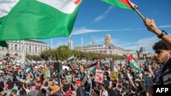 FILE —People take part in a "Palestine Solidarity" march in front of City Hall in San Francisco, California, on November 4, 2023. 