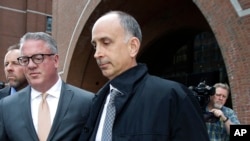 California businessman Stephen Semprevivo departs federal court, May 7, 2019, in Boston, after pleading guilty to charges that he bribed the Georgetown tennis coach to get his son admitted to the school.