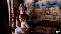 An Eritrean woman and her child at the Mai Aini refugee camp in northern Ethiopia on Jan. 30, 2021.