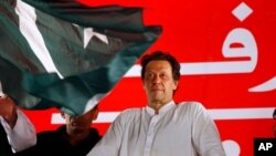 FILE - Pakistani politician Imran Khan arrives to address an election campaign rally in Islamabad, Pakistan, July 21, 2018.