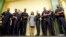 Rodney King's daughter Lora King stands shoulder-to-shoulder with a group of Los Angeles Police Officers as they meet with young people who have had run-ins with police, in downtown Los Angeles, Sept. 15, 2016. 