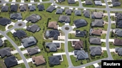 FILE - An aerial view shows The Villages retirement community in Central Florida, June 27, 2015. Urban sprawl is among the factors driving loss of natural land.