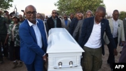 Members of the Cabinet of Botswana carry the coffin of the late Pitseng Gaoberekwe during a funeral and memorial service in Metsiamanong village, Central Kalahari Game Reserve (CKGR), on Dec. 10, 2024.