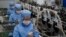 Workers of the Ryongaksan Soap Factory make disinfectant in Pyongyang, North Korea Thursday, March 19, 2020. North Korea has been engaged in an intense campaign to guard against COVID-19, though it hasn’t officially reported any cases of infection…