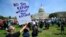 FILE - Protesters gather on Capitol Hill in Washington during a Tax Day demonstration calling on President Donald Trump to release his tax returns, April 15, 2017. 