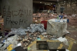 Debris and graffiti are seen inside the Hong Kong Polytechnic University campus, in Hong Kong, Nov. 22, 2019.