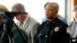 FILE - Charlottesville Police Chief Al S. Thomas Jr. listens to Attorney Timothy Heaphy as he delivers an independent report on the issues concerning the white supremacist rally and protest in Charlottesville, during a news conference in Charlottesville, Va., Friday, Dec. 1, 2017.