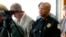 FILE - Charlottesville Police Chief Al S. Thomas Jr. listens to Attorney Timothy Heaphy as he delivers an independent report on the issues concerning the white supremacist rally and protest in Charlottesville, during a news conference in Charlottesville, Va., Friday, Dec. 1, 2017.