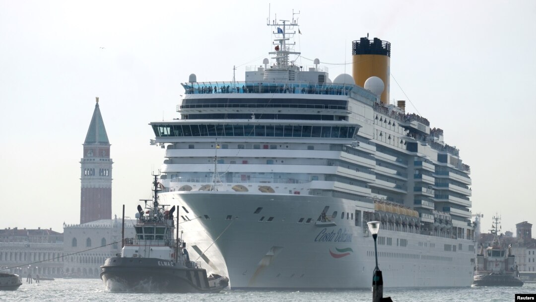 The Costa Deliziosa cruise ship passes in the Saint Mark Basin in Venice, Italy, June 9, 2019. Passengers on the ship's around-the-world cruise, begun before the coronavirus pandemic struck, are finally approaching the end of their voyage.