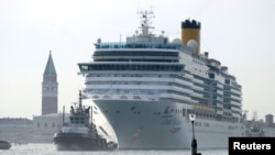 FILE - Costa Deliziosa cruise ship passes in the Saint Mark Basin in Venice, Italy, June 9, 2019. 
