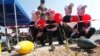 FILE - Schoolchildren attend an awareness campaign teaching them to identify mines and unexploded cluster bombs at the United Nations Interim Force in Lebanon (UNIFIL) headquarters in the town of Naqoura in southern Lebanon, April 4, 2014. 