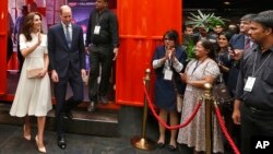 Britain's Prince William, second left, and his wife Kate, left, the Duchess of Cambridge, arrive at a young entrepreneurs' event in Mumbai, India, April 11, 2016. 