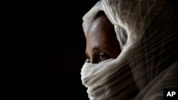 FILE - A 40-year-old woman who was says she was held captive and repeatedly raped by 15 Eritrean soldiers over a period of a week speaks during an interview at a hospital in Mekele, in the Tigray region of northern Ethiopia, May 14, 2021.