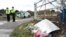 File - Flowers and messages of condolence for Sarah Everard are seen near Ashford, southeast England, on March 12, 2021 where police officers found human remains. A body found hidden in woodland in Kent was identified as that of Sarah Everard.