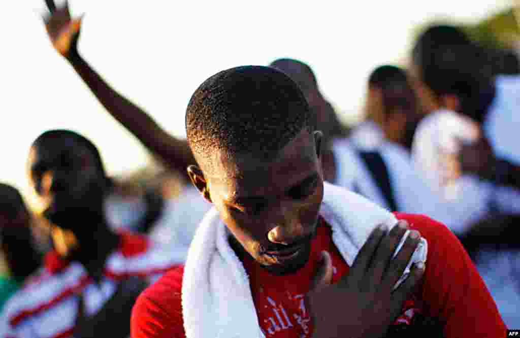 January 12: A Haitian observes a minute of silence at 4:53 pm, the time the earthquake struck a year ago, in honor of the quake victims in Port-au-Prince. Jorge Silva/Reuters