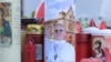 Candles are laid at the statue of John Paul II outside the Gemelli University Hospital where Pope Francis is hospitalized with pneumonia, in Rome, Italy, March 02, 2025.