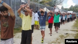 FILE - An undated image released Nov. 13, 2017, shows detainees staging a protest inside the compound at the Manus Island detention center in Papua New Guinea.