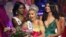 Karlie Hay (C) reacts as Miss USA 2016 Deshauna Barber (L) and Miss Teen USA 2015 Katherine Haik (R) crown Hay Miss Teen USA 2016 at The Venetian Las Vegas in Las Vegas, Nevada, July 30, 2016. 