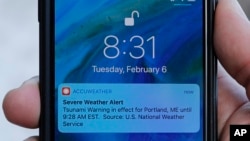 FILE - An alert is displayed on a phone Feb. 6, 2018, in Portland, Maine.