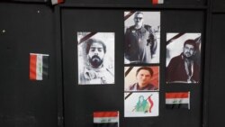 A wall in a Mosul, Iraq, cultural center features pictures of protesters who died in clashes on Jan. 29, 2020. (H.Murdock/VOA)