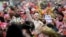 Revellers celebrate the start of the Carnival season in Cologne, western Germany, on November 11, 2021. 