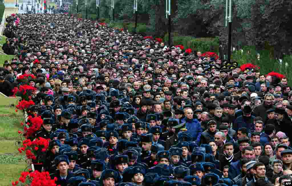 People visit Alley of Martyrs, a cemetery and memorial dedicated to those killed by Soviet troops during the 1990 Black January crackdown, in Baku, the capital of Azerbaijan.