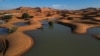 A drone view shows sand dunes partially covered by floodwaters, after rare rainfall hit the area last September, in Merzouga, Morocco, Oct. 24, 2024.