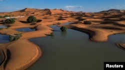 A drone view shows sand dunes partially covered by floodwaters, after rare rainfall hit the area last September, in Merzouga, Morocco, Oct. 24, 2024.