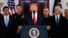 President Donald Trump addresses the nation from the White House on the ballistic missile strike that Iran launched against Iraqi air bases housing U.S. troops, Wednesday, Jan. 8, 2020, in Washington, as Vice President Mike Pence and others looks on…